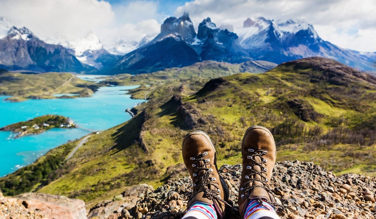 A hiker admires a view of Patagonia's famous horn-shaped mountains