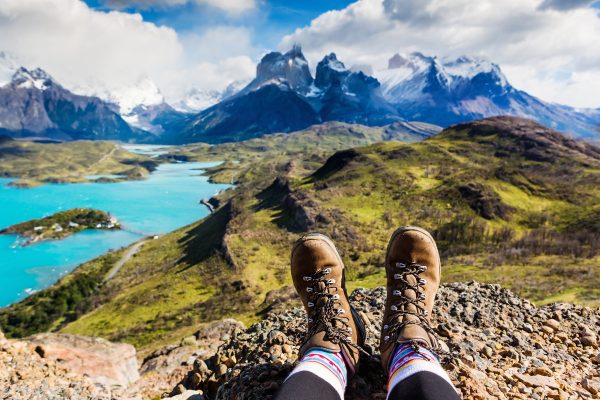 A hiker admires a view of Patagonia's famous horn-shaped mountains