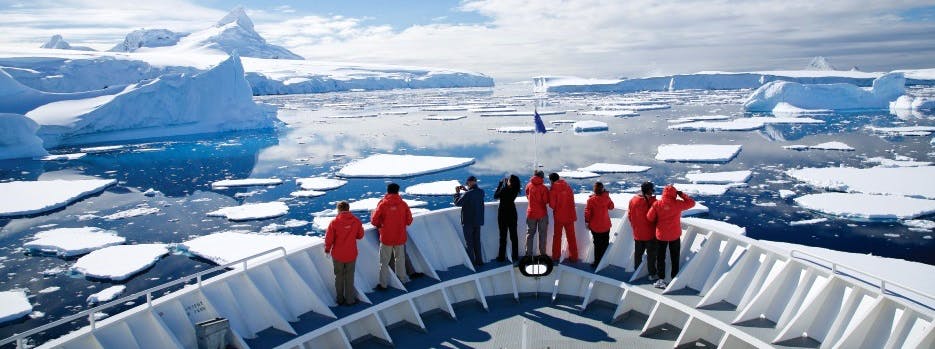 View of icy seas from the bow of an Antarctic expedition ship